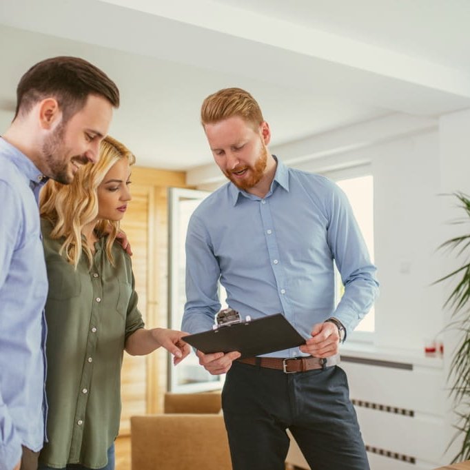 young couple getting a in-home flooring estimate